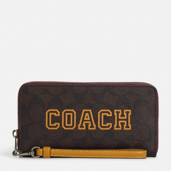 Coach Handbags - NWT💃Coach Long Zip Around Wallet In Signature Canvas With Varsity Motif